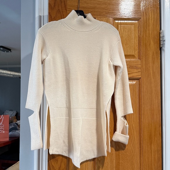Stella McCartney Cream Turtleneck Sweater w/ cut out arms & open vents on side - Picture 1 of 8